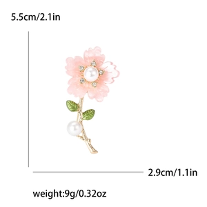 Fashionable pink daisy flower brooch with pearls and crystals on a gold base