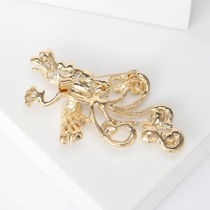 Elegant gold phoenix brooch in luxury alloy with intricate cutout design for suits