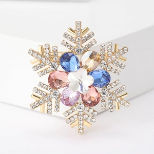 Detailed close-up of a luxury snowflake brooch with multicolored teardrop crystals