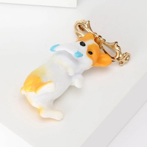 Cute cartoon Corgi puppy brooch in orange and white alloy with a golden bow