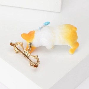 Cute Corgi dog brooch in orange and white enamel with a golden metal pin base