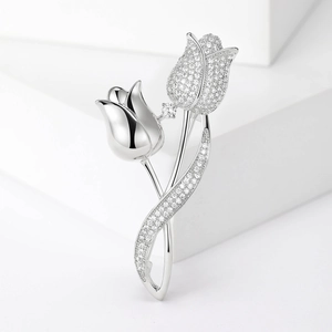 Detailed view of tulip brooch featuring pavé cubic zirconia and mirror polished petals