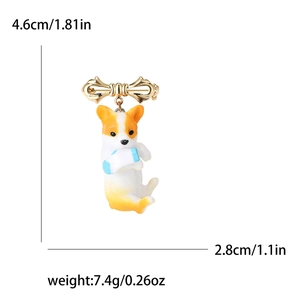 Cute corgi dog alloy brooch with gold bow and bone detail on white background