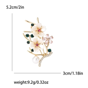 Elegant peach blossom pearl brooch with floral crystals and rhinestones in gold finish