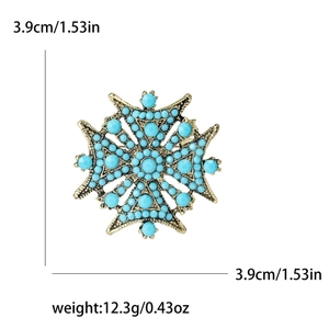 Broche étoile à huit branches style bohème en or antique avec perles de turquoise