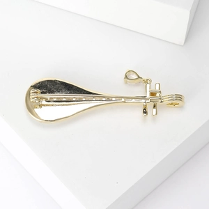 Elegant gold Pipa instrument brooch with shell inlay and secure safety pin fastener