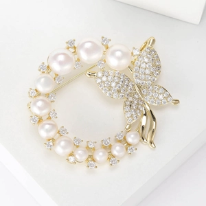 Elegant gold ring brooch with white pearls and micro-pave zircon butterfly design