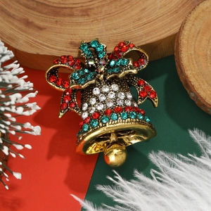 Festive Christmas bell brooch in gold alloy with red and green rhinestones and bow tie