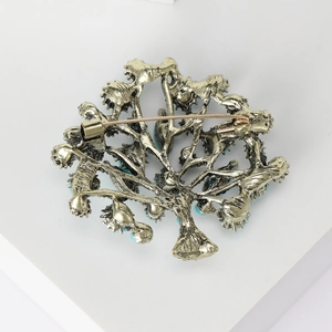 Vintage gold tree brooch with turquoise beads and secure back pin mechanism