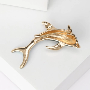 Polished gold alloy dolphin brooch showing high-quality back pin closure detail