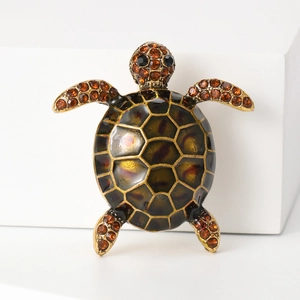 Vintage crystal turtle brooch with brown enamel shell and amber rhinestone details