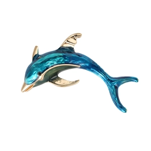 Elegant gold dolphin brooch with blue enamel gradient finish on a white background