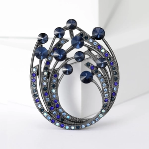 Elegant swirl flower brooch with deep blue crystals and rhinestones in gun black finish