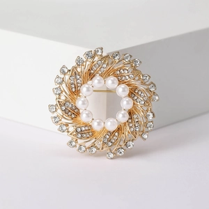 Elegant floral wreath brooch with lustrous white pearls and sparkling crystals on gold alloy