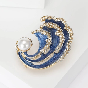 Elegant blue wave brooch with gold plating, sparkling rhinestones and a large white pearl