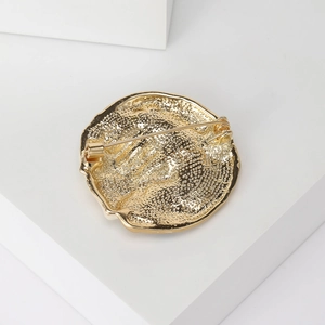 Vintage sun moon brooch with golden textured back and secure pin clasp closure
