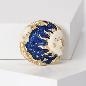 Vintage sun and moon enamel brooch with gold frame and starry blue sky aesthetic style