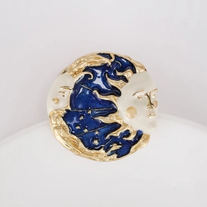 Vintage sun and moon enamel brooch in celestial gold and deep blue starry sky theme