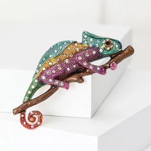 Sparkling rhinestone chameleon brooch on branch with vibrant multicolored crystals
