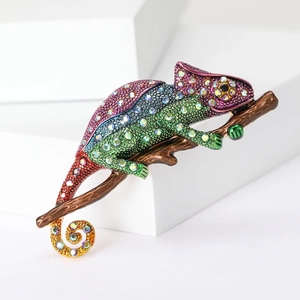 Exquisite rhinestone chameleon brooch in vibrant gradient enamel on a realistic branch