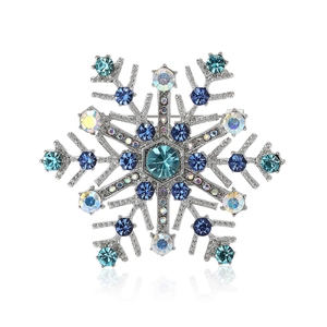 Broche flocon de neige argentée avec cristaux bleus et pierres arc-en-ciel
