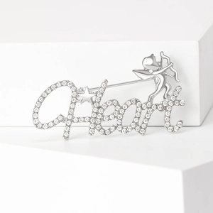 Silver cupid angel brooch with heart letter and sparkling white rhinestones on white cubes