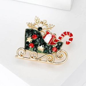 Exquisite Christmas carriage brooch with red and green rhinestones on white platform