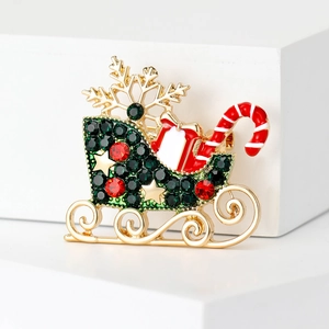 Elegant Christmas carriage brooch with green rhinestones and festive holiday charms