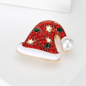 Fashionable Christmas hat brooch with red rhinestones and a white pearl on golden base