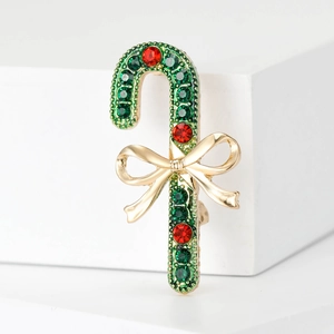 Creative Christmas candy cane brooch with red and green rhinestones and golden bowknot