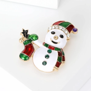 Broche bonhomme de Noël en métal doré avec bonnet rayé et strass brillants décoratifs