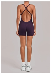 Detail of cross back straps on a deep purple yoga bodysuit with high elastic fabric