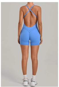 Detail of light blue yoga jumpsuit featuring cross-back straps and butt-lifting V-seam design