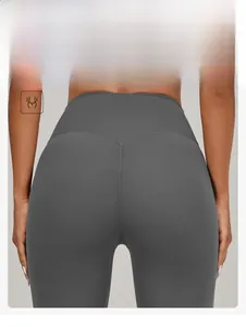 Detail view of high-waist grey yoga leggings featuring V-shaped seams and scrunch butt design