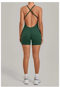 Rear view of dark green backless yoga jumpsuit with crisscross straps and V-line stitching