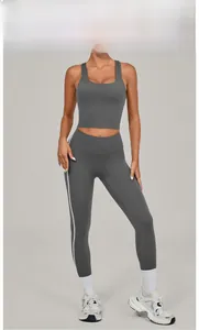 Detailed view of women's dark grey high-waisted yoga leggings and sports vest set