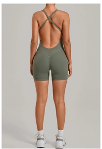 Detail of cross-back straps and open-back design on olive green athletic bodysuit