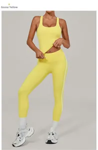 Detail of high-waisted goose yellow yoga leggings with white side stripes for women