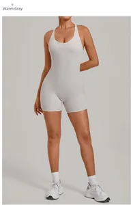 Sleek women's yoga bodysuit in warm stone grey featuring a high-stretch fitted design