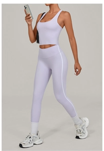 Close-up of lavender yoga set featuring high-waist leggings with white side stripes