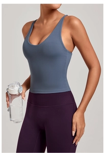 Détails du tissu haute élasticité et coutures renforcées sur le gilet de yoga bleu