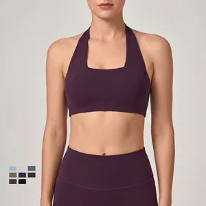 Completo sportivo color prugna con reggiseno all'americana e leggings da yoga traspiranti