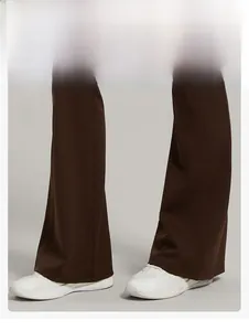 Detail view of coffee brown flared yoga pants showing slim fit design and hem