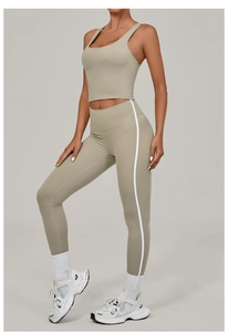 Detail view of khaki yoga set with high waist leggings and side white stripe decoration