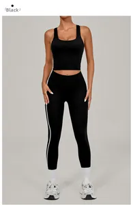 Detail of black U-neck sports vest and yoga leggings with white side stripes