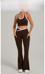 Detail of high-waist yoga pants with V-cross waistband design and side pockets