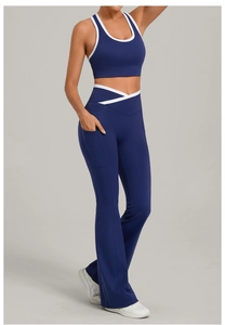 Detail of high-waisted yoga pants with V-cross waistband and side pockets for women