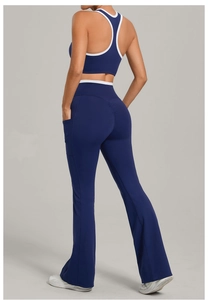 Detail of navy blue yoga set showing contrast piping vest and back scrunch leggings