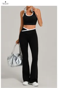 Detail of black yoga set featuring U-neck crop top and crossover waist flare leggings