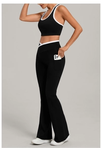 Detail view of high-waist flared yoga pants with side phone pocket and contrast trim
